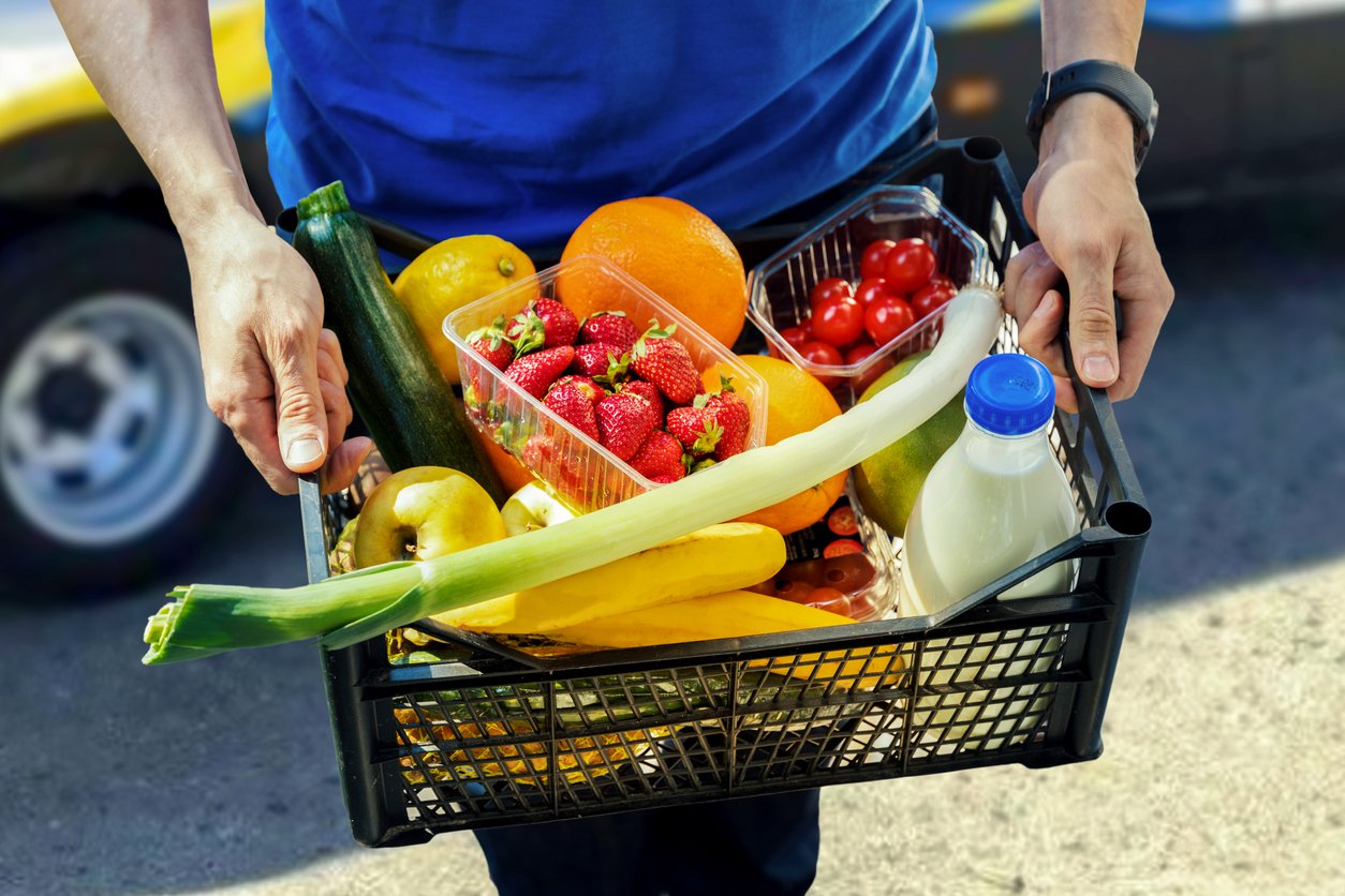 Grocery delivery driver delivering fresh groceries 