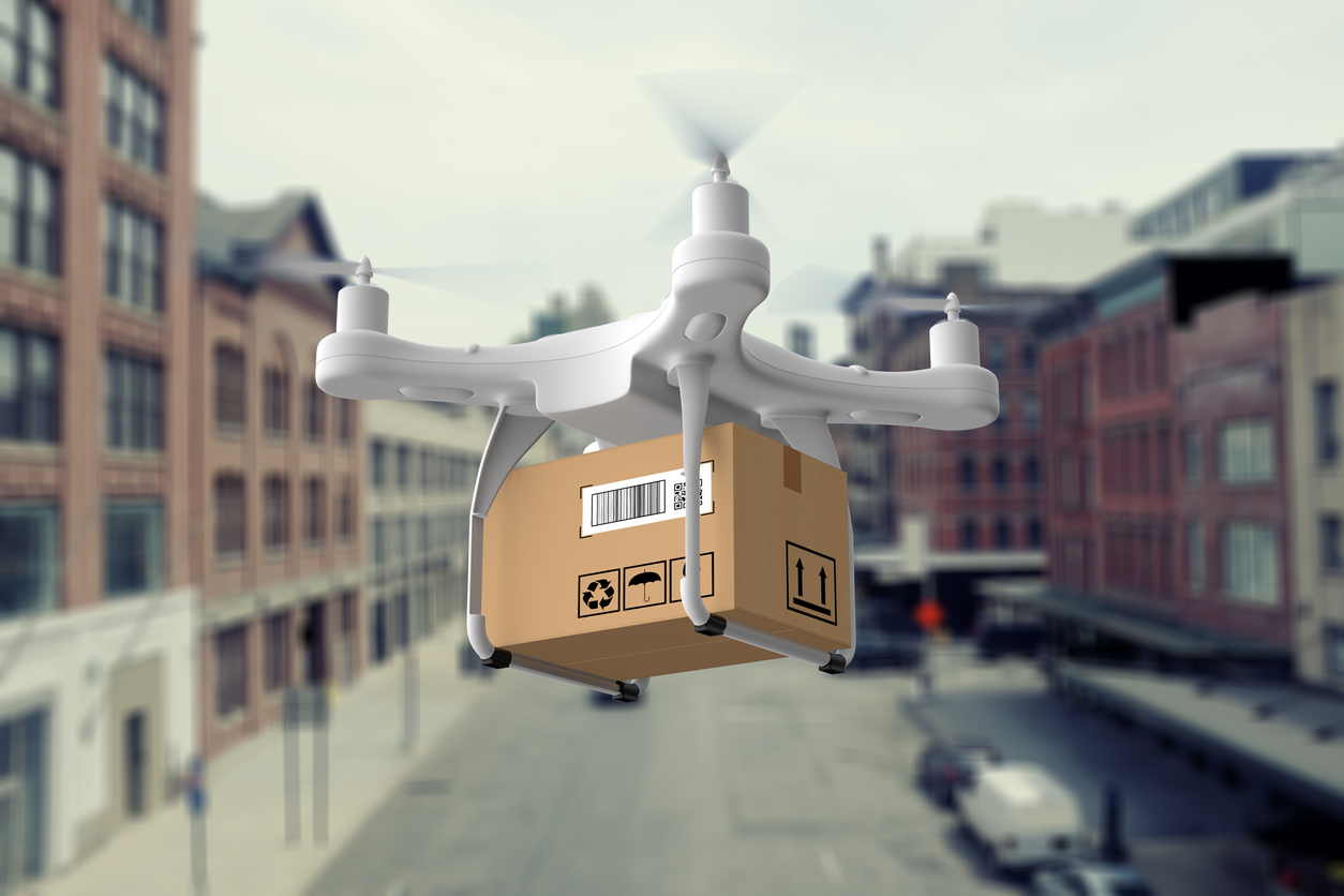 Last mile delivery 2021 trends with a delivery drone carrying a package.