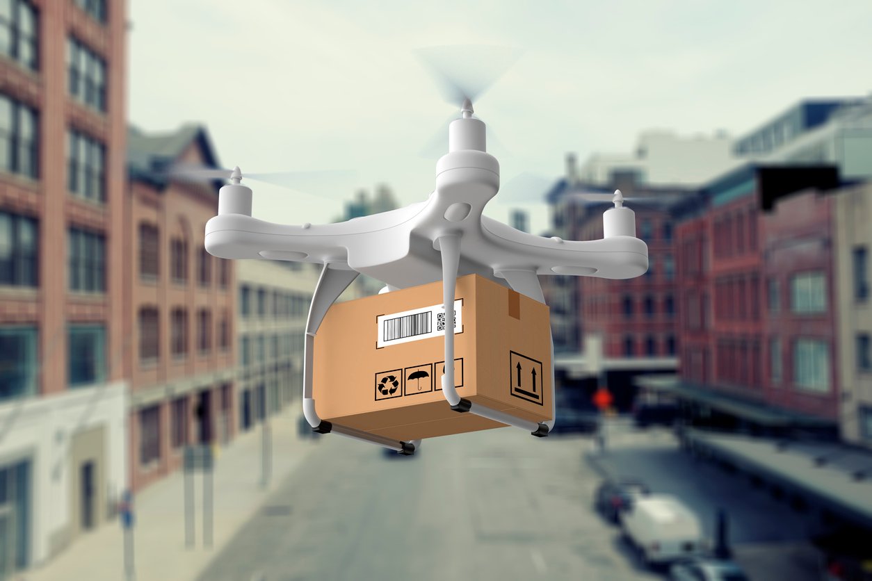 Last mile delivery 2024 trends with a delivery drone carrying a package.